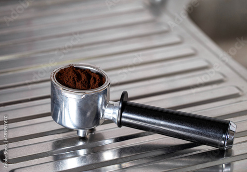 Photos Coffee maker horn on a metal background, close-up