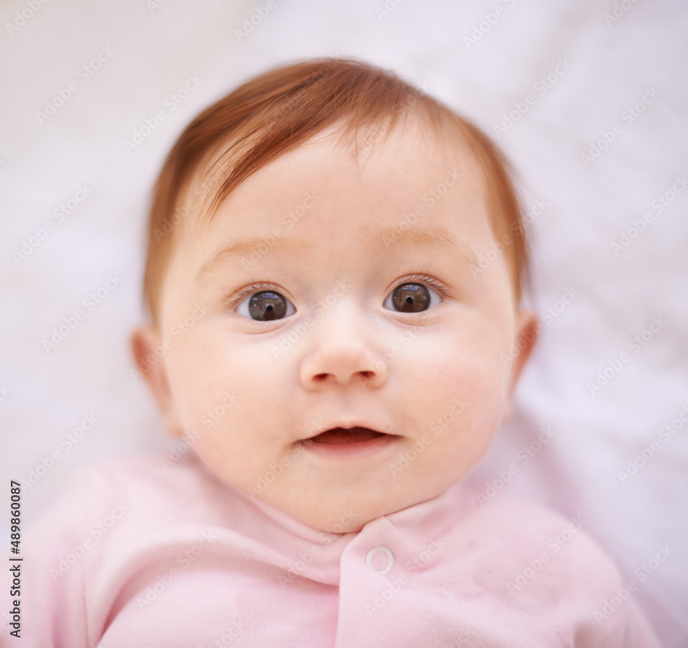 Shes a treasure. Shot of an adorable baby girl with red hair.