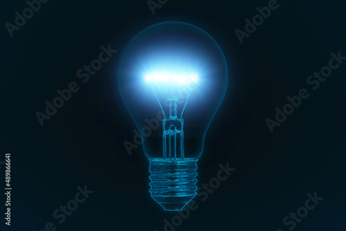 Light bulb on a dark blue background