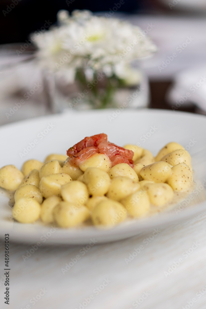 small gnocchi with raw shrimp and pepper