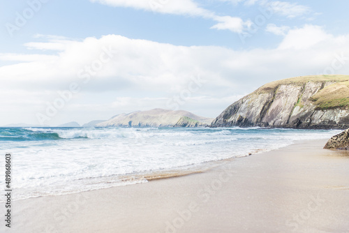 Sunny day on sandy Coumeenoole beach on Slea head, Dingle peninsula in County Kerry, Ireland