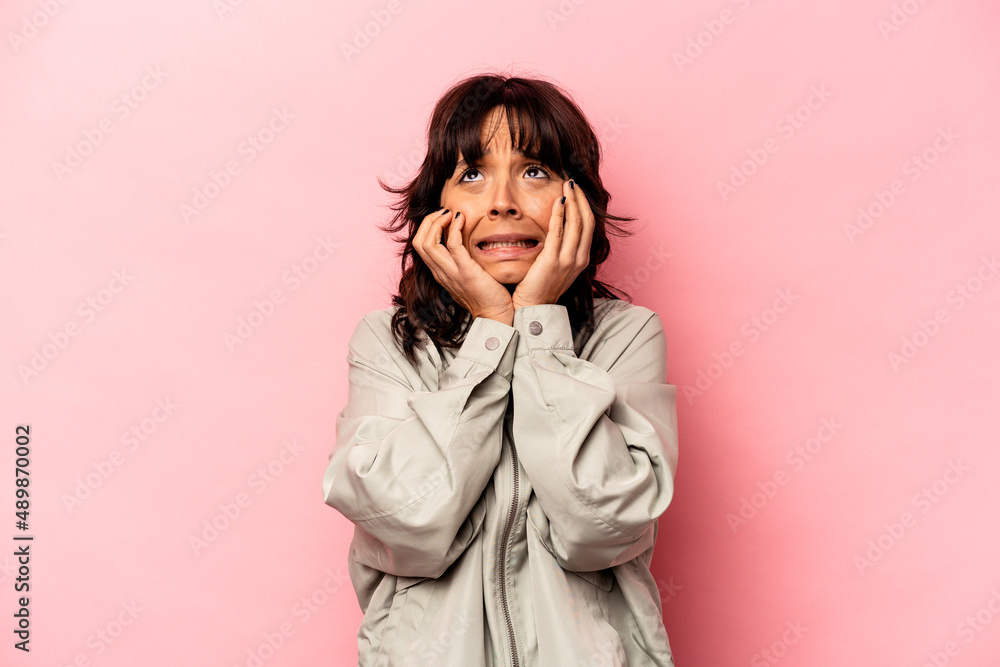 Young hispanic woman isolated on pink background whining and crying disconsolately. Young hispanic woman isolated on pink background whining and crying disconsolately.