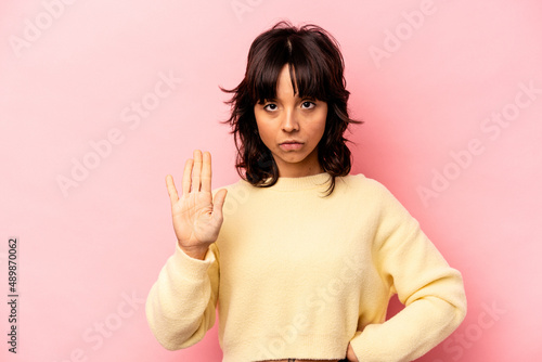 Wallpaper Mural Young hispanic woman isolated on pink background standing with outstretched hand showing stop sign, preventing you. Torontodigital.ca