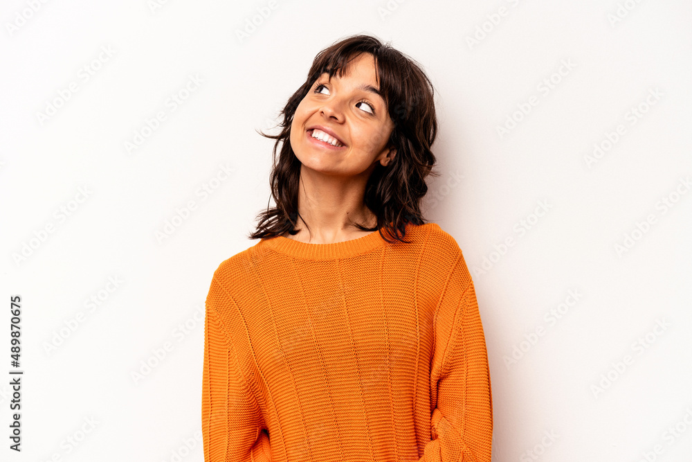 Young hispanic woman isolated on white background relaxed and happy laughing, neck stretched showing teeth. Young hispanic woman isolated on white background relaxed and happy laughing, neck stretched showing teeth.