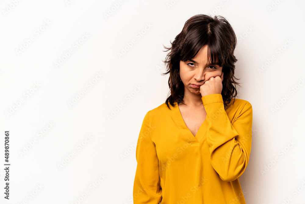 Young hispanic woman isolated on white background who feels sad and pensive, looking at copy space. Young hispanic woman isolated on white background who feels sad and pensive, looking at copy space.