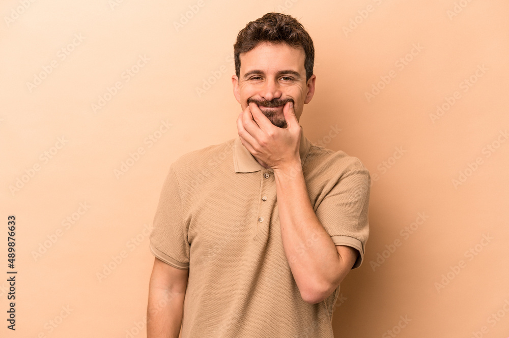 Young caucasian man isolated on beige background doubting between two options.