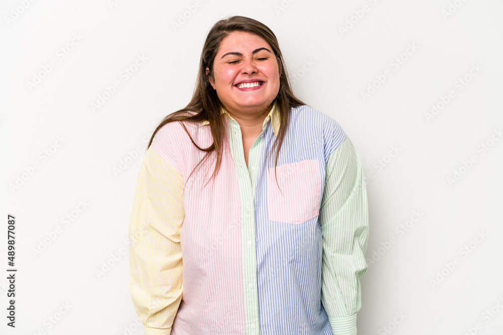 Young caucasian overweight woman isolated on white background laughs and closes eyes, feels relaxed and happy. Young caucasian overweight woman isolated on white background laughs and closes eyes, feels relaxed and happy.