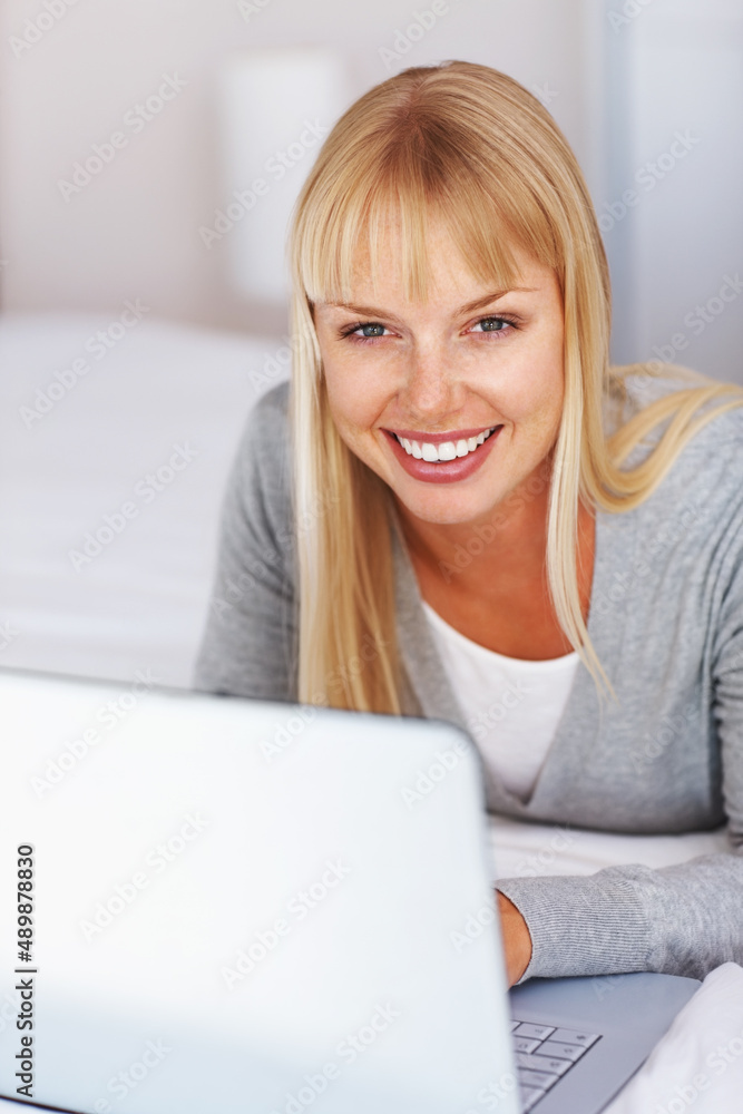 Young woman working on laptop. Pretty young college student working on laptop and smiling. Young woman working on laptop. Pretty young college student working on laptop and smiling.
