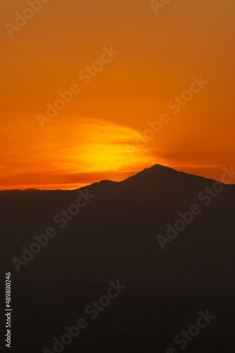Sunset or evening sky view of mountain hill.