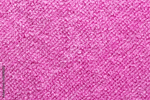 Pink terry towel, background, close-up. Handmade, textile
