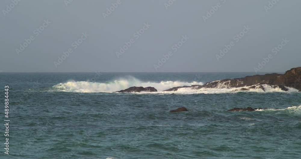 Huge Waves Crashing On Sea Rocks In Fistral Bay, Newquay, England - slow motion Huge Waves Crashing On Sea Rocks In Fistral Bay, Newquay, England - slow motion