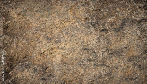 texture of brown colored nature stone - grunge stone surface background	

