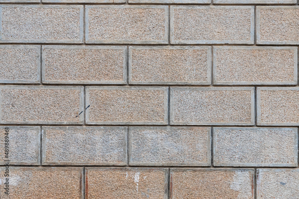 The antique wall is paved with gray stones, top view. stone texture, outdoor stone tiles The antique wall is paved with gray stones, top view. stone texture, outdoor stone tiles
