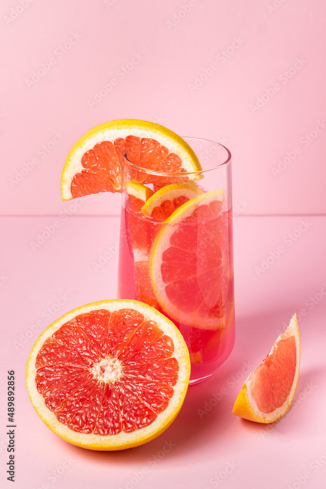 Pink cocktail with grapefruit on a pink background. Sweet fruit cocktail. delicious drink Pink cocktail with grapefruit on a pink background. Sweet fruit cocktail. delicious drink