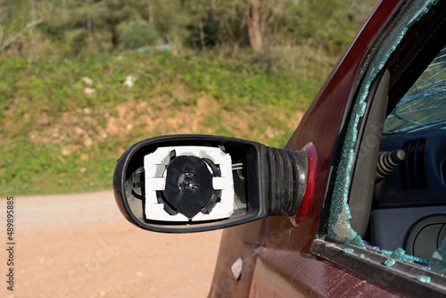 Broken outside rearview mirror. Body Rearview mirrors without glass. Broken car  photo
