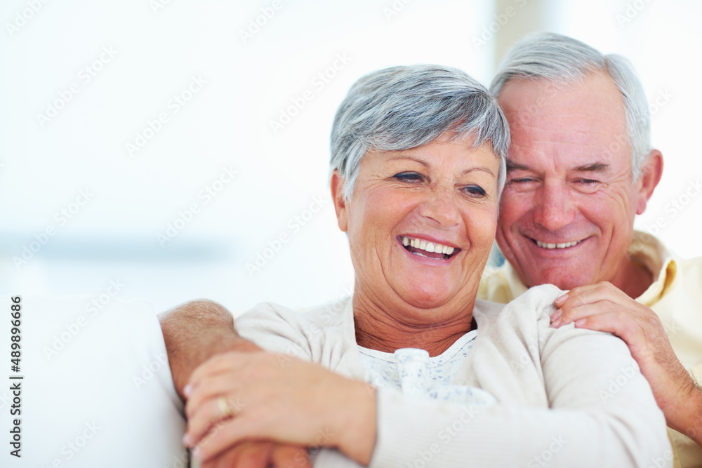Smiling mature couple relaxing at home. Portrait of smiling mature couple spending time together at home. Smiling mature couple relaxing at home. Portrait of smiling mature couple spending time together at home.
