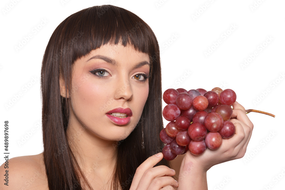 Portrait of young woman posing with grapes Portrait of young woman posing with grapes