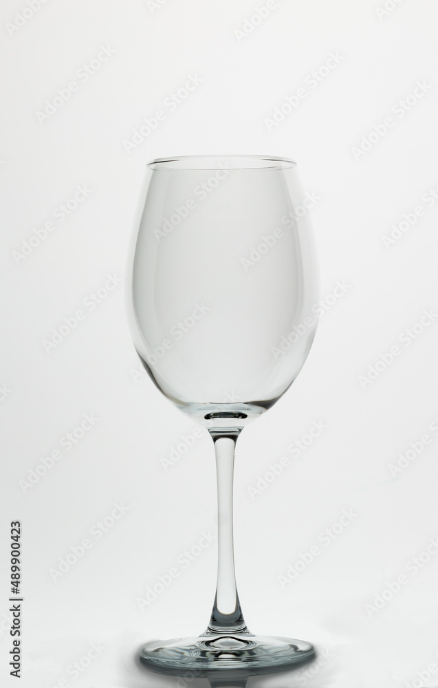 Empty wine glass on a white background