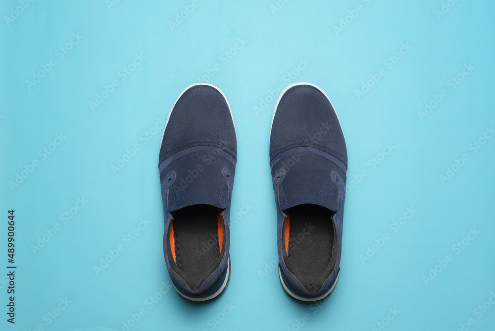 Top view of Casual shoes on blue color background. Top view of Casual shoes on blue color background.