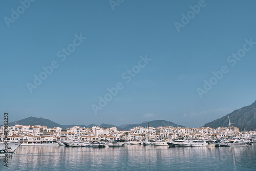 Harbor entrance with the watchtower to the left and La Concha mountain to the rear, Puerto Banus, Marbella, Costa del Sol, Malaga Province, Andalucia, Spain, Western Europe. photo