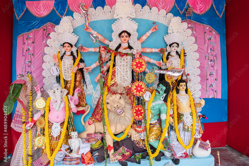 Goddess Durga idol at decorated Durga Puja pandal, at Kolkata, West Bengal, India. Durga Puja is biggest religious festival of Hinduism and is now celebrated worldwide.