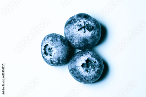 a few delicious blueberries. wild berries on a white background. 
