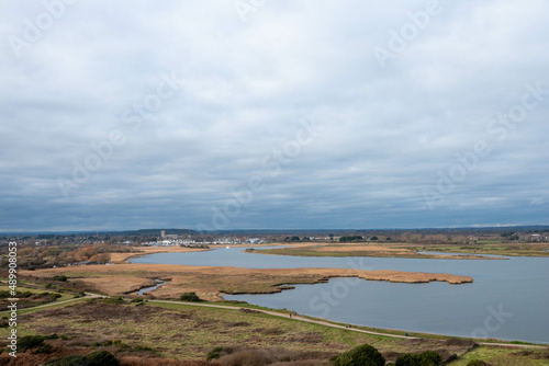 view from Hengistbury Head Dorset England with Christchurch Priory in the background © Penny
