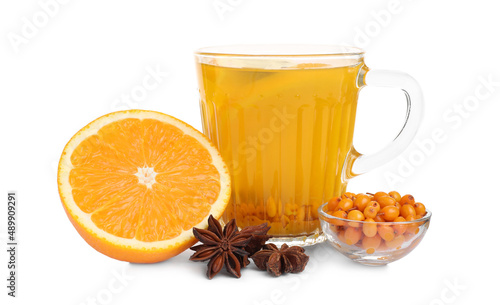 Glass cup of immunity boosting drink and ingredients on white background