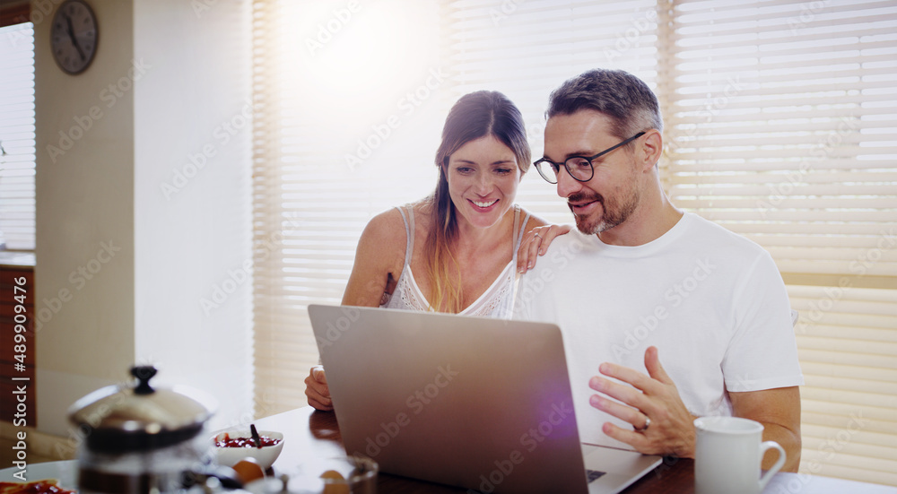 They have a bunch of websites they love to visit together. Shot of a mature couple using a laptop together at home. They have a bunch of websites they love to visit together. Shot of a mature couple using a laptop together at home.