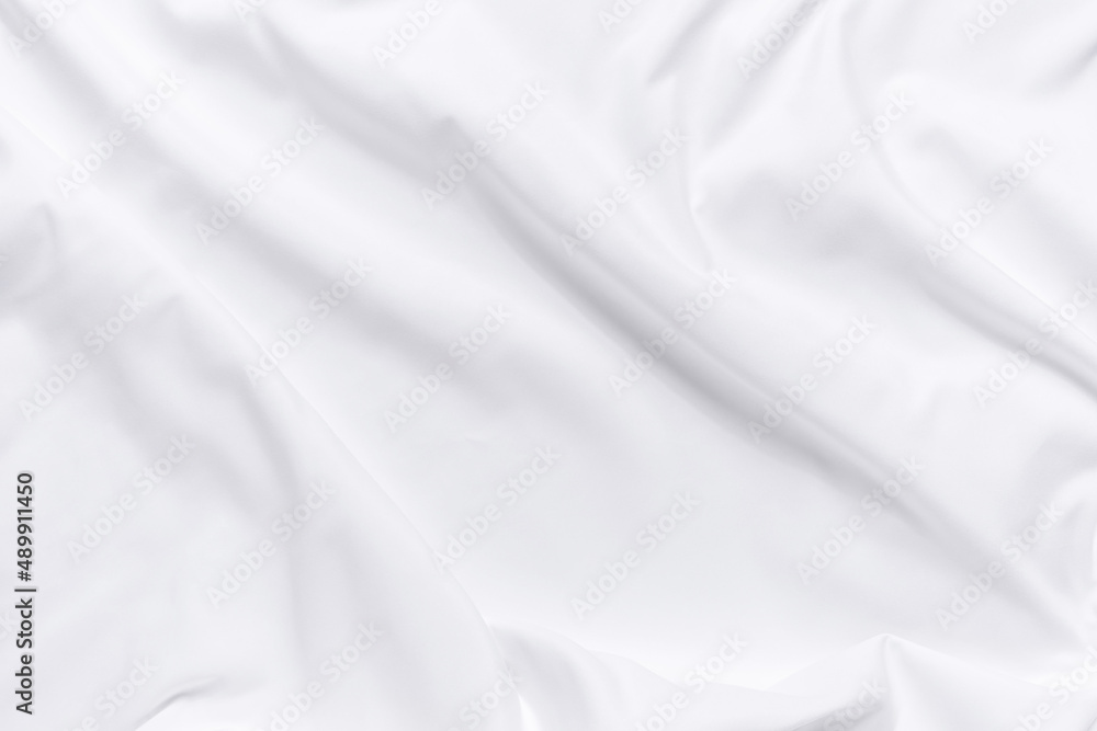 White fabric texture background. Cloth soft wave. Creases of satin, silk, and cotton.