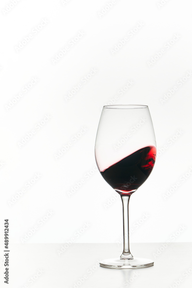 Glass of red wine isolated on white