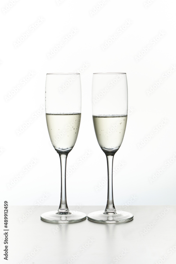 Two glasses of champagne. Isolated on white