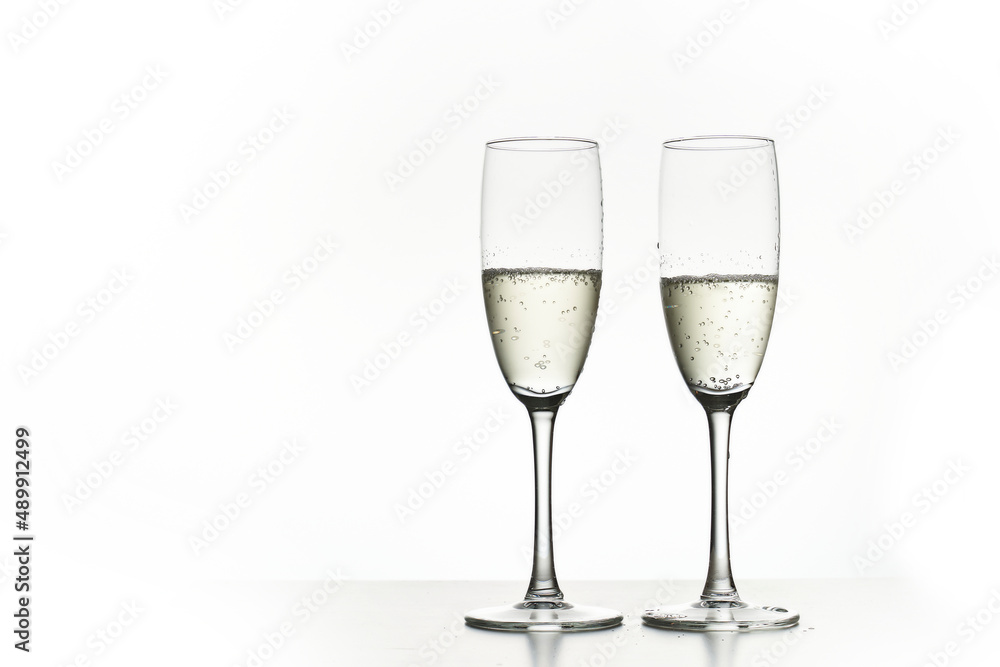 Two glasses of champagne. Isolated on white