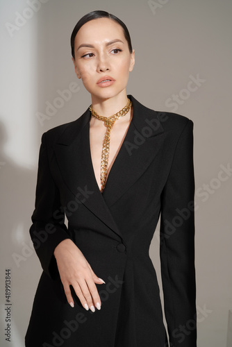 Beautiful young lady in a black pantsuit
