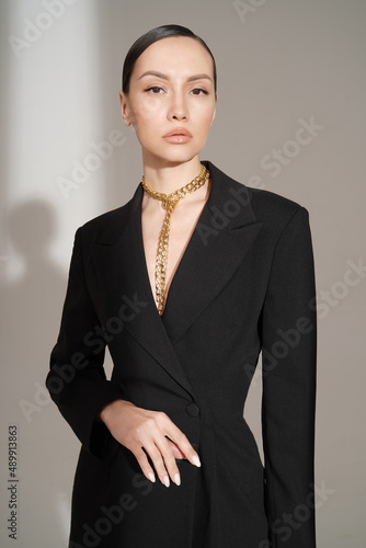 Beautiful young lady in a black pantsuit