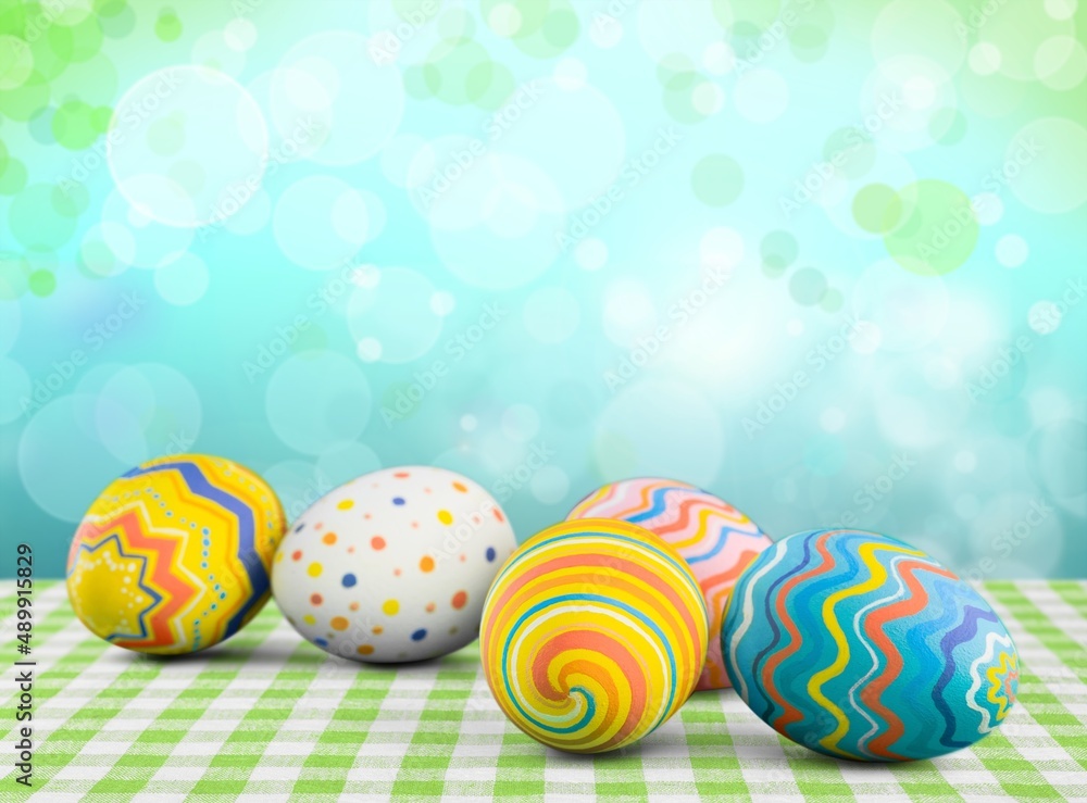 Stylish Easter eggs on rustic background. Happy Easter! Natural dyed colorful eggs