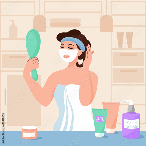 Face care at home. Woman with mirror in her hand doing homemade facial mask