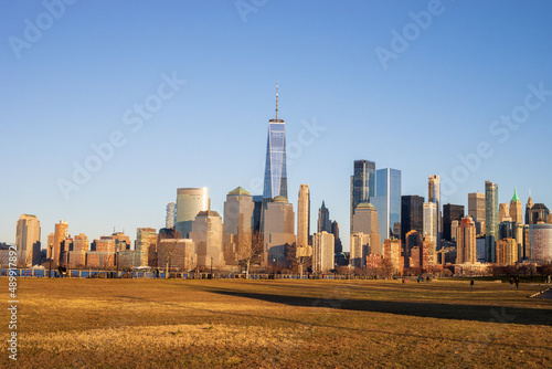 Jersey City, New Jersey, USA - December 22 2021: New York City downtown skyline. Financial district and World Trade Center. View from Statue of Liberty State Park.