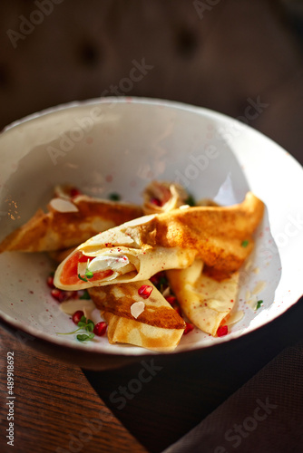 Pancakes with ricotta and mascarpone with red pomegranate