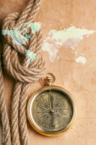 Retro style antique golden compass. Sailing accessories. Wanderlust, travel and navigation theme