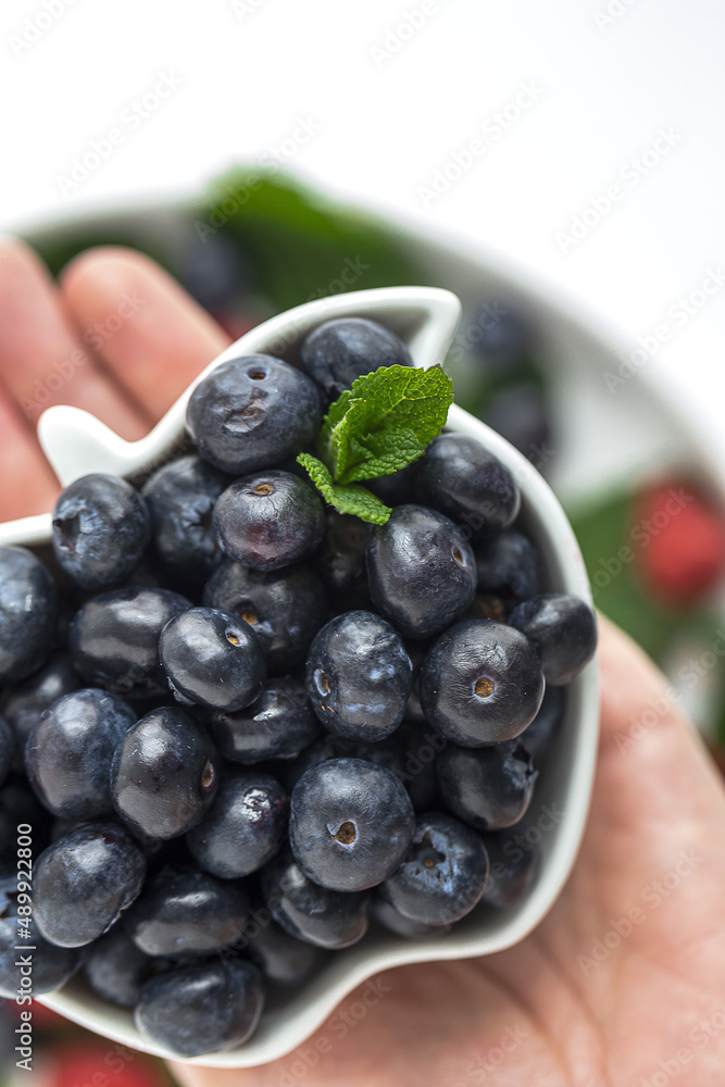 Assortment of red fruits, strawberries, blueberries and raspberries, close up Assortment of red fruits, strawberries, blueberries and raspberries, close up