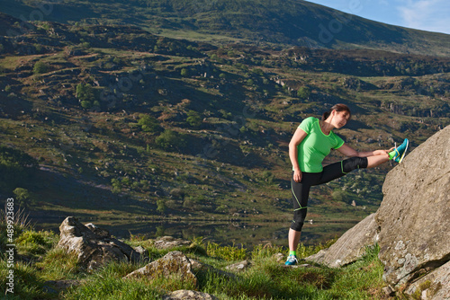 Woman stretching at Snowdonia National Park photo