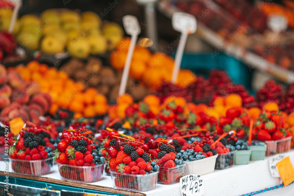 Fruits and berries on the street market.