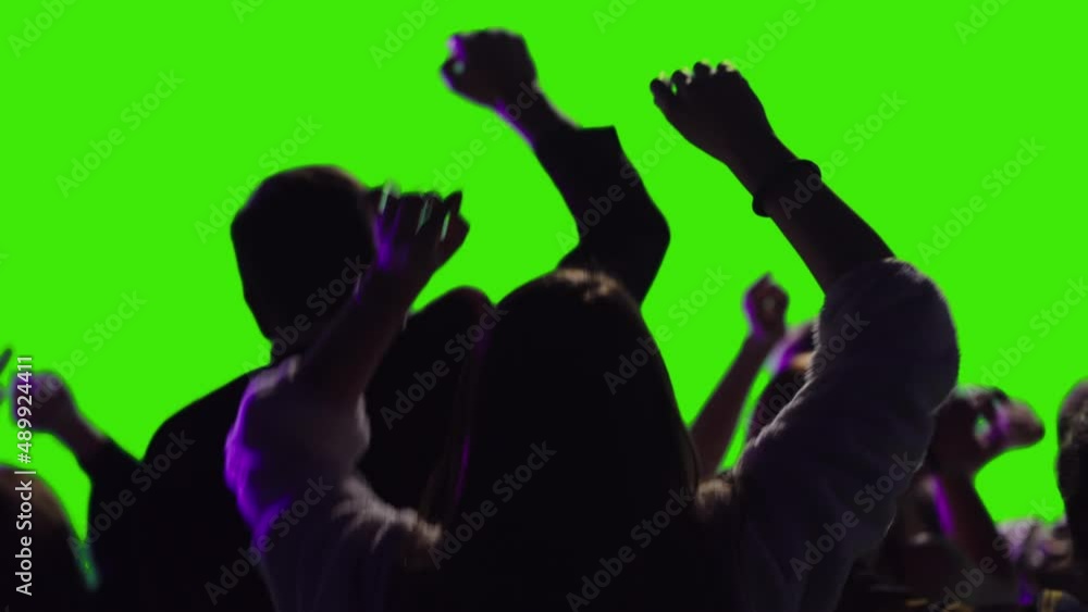 Teen boys and girls dancing together in a festival greenscreen Teen boys and girls dancing together in a festival greenscreen