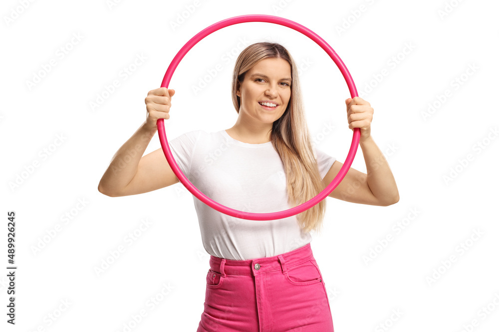Young woman holding a hula hoop and smiling Young woman holding a hula hoop and smiling