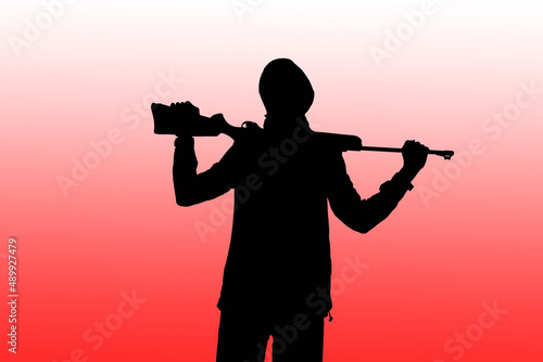 Silhouette of a man with a weapon in his hands against the background of art, lilac sky, the color of the year 2022. The concept of military operations, conflict resolution. Copyspace.