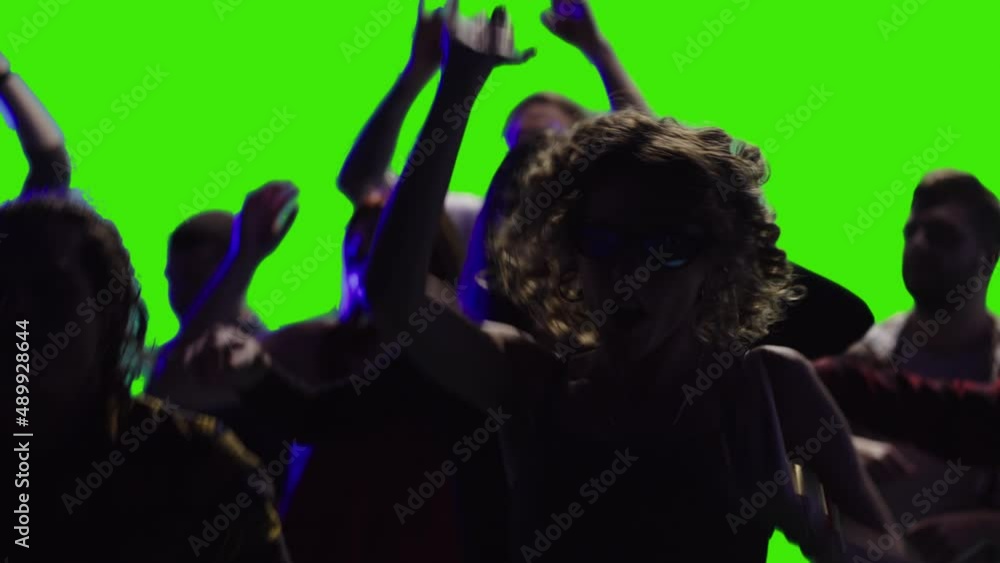 a few joyful people are dancing together at a discotheque in slow-motion greenscreen a few joyful people are dancing together at a discotheque in slow-motion greenscreen