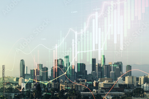 Abstract virtual financial graph hologram on Los Angeles cityscape background, financial and trading concept. Multiexposure