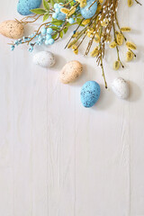 Willow branches and decorations, easter eggs on a light background. Happy easter flat lay concept