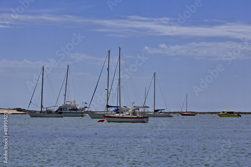 Anchored sailboats among the barrier islands-Ria Formosa intertidal channels. Faro-Portugal-129
